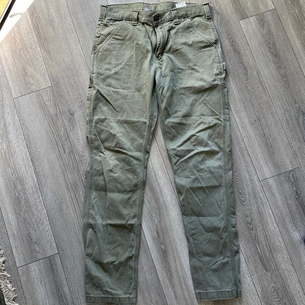 Distressed Carhartt relaxed fit olive green pants some staining Size 34 x 34